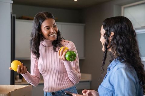 Friends Collaborating in Modern Kitchen for Cooking Project