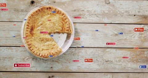 Golden pot pie with missing slice on rustic wood planks with social media badges