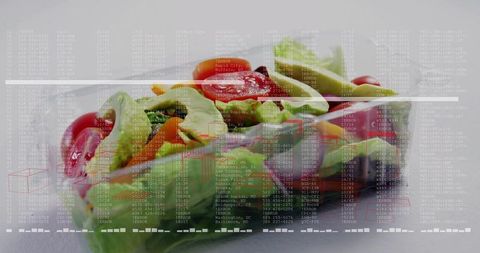 Takeaway salad in clear clamshell showing lid condensation with digital data overlay