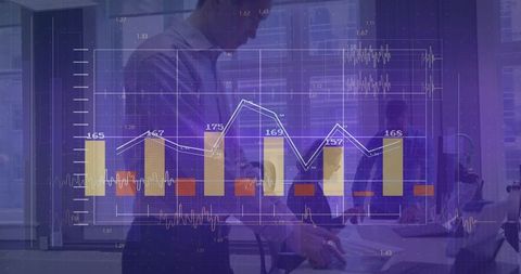 Business team analyzing interactive financial dashboard overlay on tablet in modern office