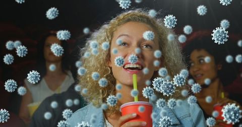 Woman in Cinema Enjoying Movie Amid Virtual Virus Particles Atmosphere