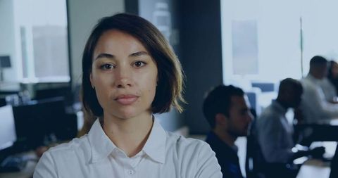 Confident Professional in Open-Plan Office Environment