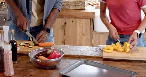 Friends Preparing Fresh Vegetables for Healthy Meal at Home