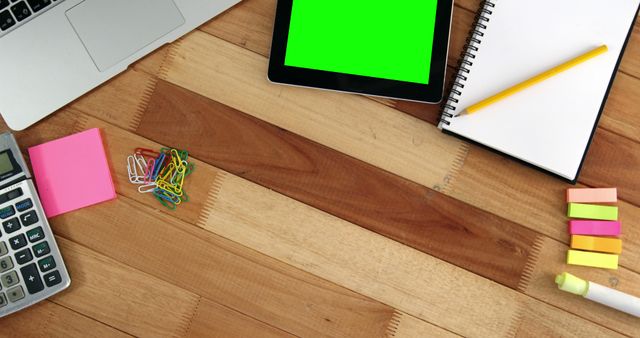 Office Desk with Tablet, Notepad, and Stationery on Wooden Surface - Download Free Stock Images Pikwizard.com