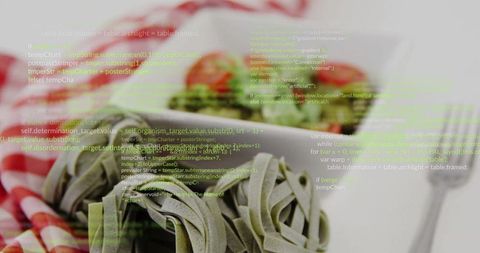 Tagliatelle nests with digital code overlay on checkered tablecloth