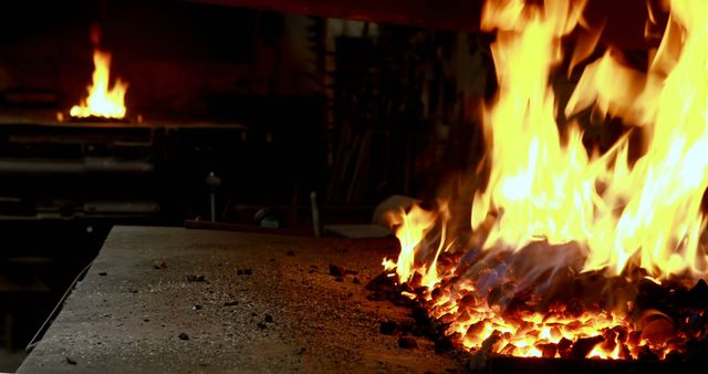 Close up of fire and cinder in forge in workshop. Blacksmith, workshop, fire and tools.