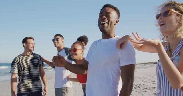 Group of Diverse Friends Laughing and Enjoying Beach Day - Download Free Stock Images Pikwizard.com