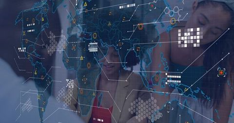 Analysts collaborating over holographic world map for global data visualization