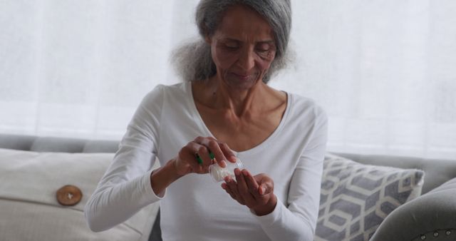 Senior Woman Using Hand Sanitizer at Home - Download Free Stock Images Pikwizard.com