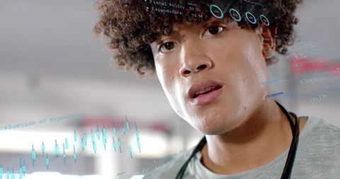 Doctor Analyzing Financial Data Overlays in Hospital Corridor