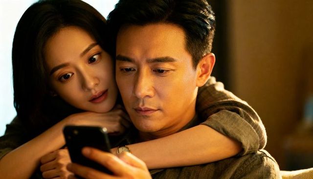 Couple sharing smartphone moment while embracing in cozy warm evening light at home