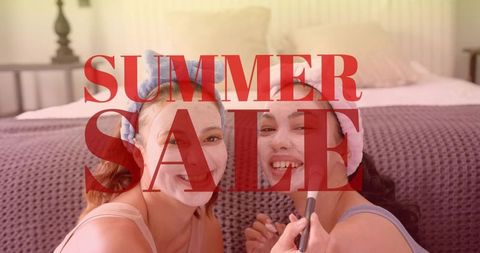 Friends applying face masks on bed smiling for summer sale beauty and spa promotion