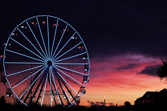 Illuminated Ferris Wheel Against Vibrant Sunset Sky - Download Free Stock Photos Pikwizard.com