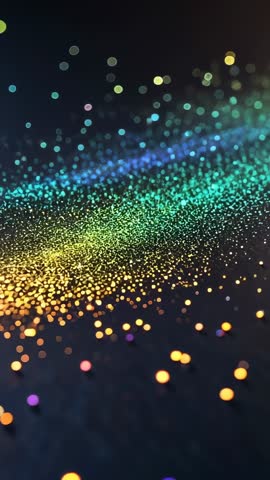 Vertical abstract video showcasing glowing rainbow particles drifting across dark surface