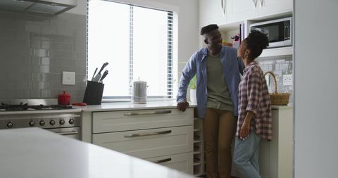 Happy African American Couple Enjoying Conversation in Modern Kitchen - Download Free Stock Images Pikwizard.com