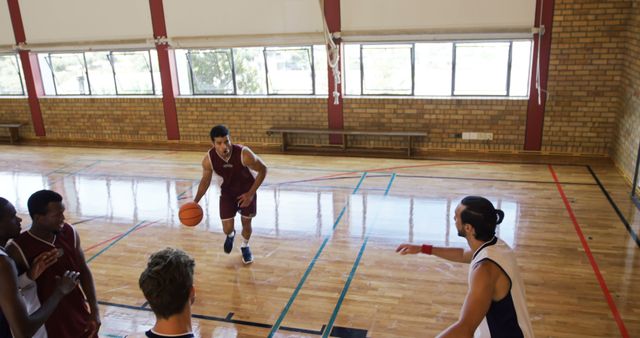 Basketball Players in Intense Game on Indoor Court - Download Free Stock Images Pikwizard.com