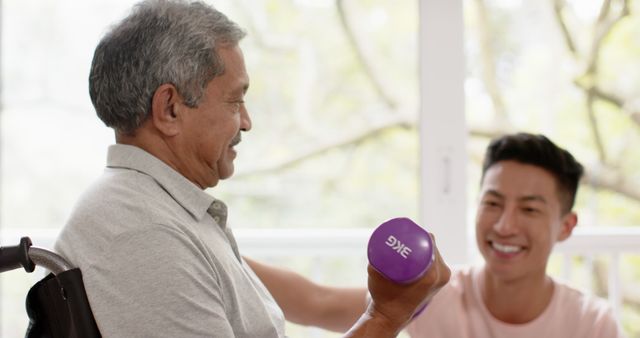 Senior Man Exercising with Dumbbells Assisted by Young Trainer - Download Free Stock Images Pikwizard.com