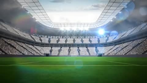 Cinematic View of an Empty Stadium with Lush Green Field and Bright Lights