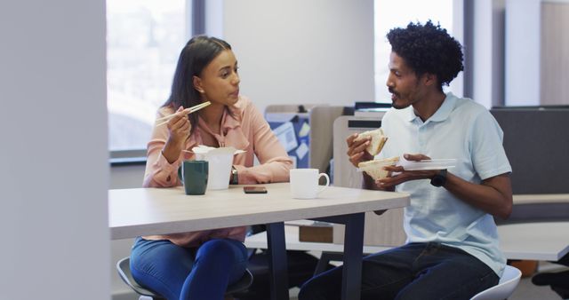 Co-workers Sharing Meal Together in Modern Office - Download Free Stock Images Pikwizard.com