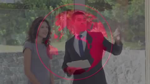 Real Estate Agent Presenting Modern Property with Virtual Globe Interface