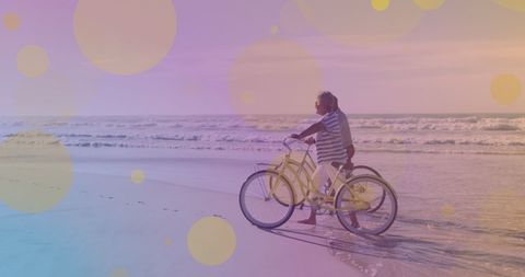 Senior Couple Strolling Beach with Bicycles at Sunset - Download Free Stock Images Pikwizard.com