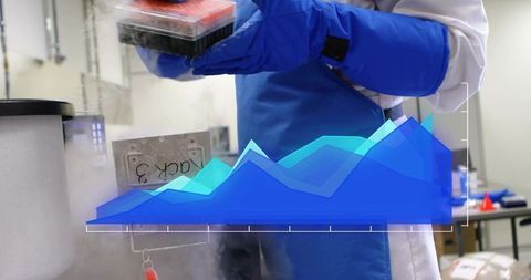 Scientist handling cryogenic sample rack with data analytics overlay in research lab