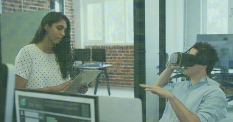 Business Professionals Leveraging Virtual Reality Technology in Modern Office