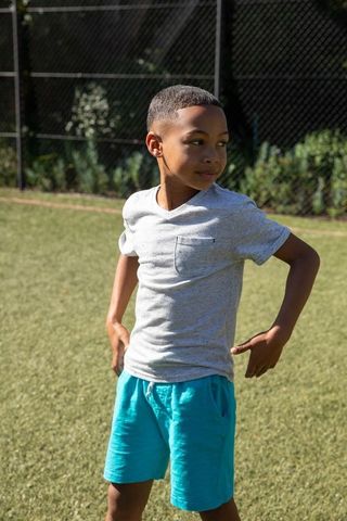 Young Athletic Boy Enjoying Outdoor Play on Sunny Day