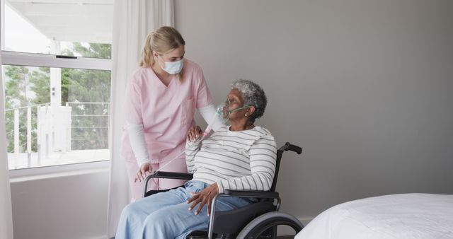 Nurse Taking Care of Elderly Patient in Wheelchair in Hospital Room - Download Free Stock Images Pikwizard.com