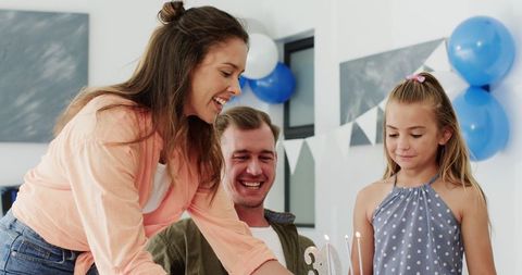 Family Birthday Celebration with Cake and Joyful Moments