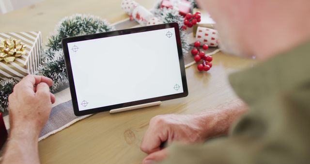 Person Using Tablet with Blank Screen During Holiday Season - Download Free Stock Images Pikwizard.com