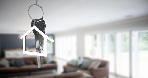 Hanging Key Symbolizing Home Ownership in Modern Living Room