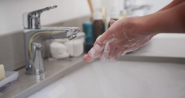 Person washing hands with soap in clean bathroom, close-up - Download Free Stock Images Pikwizard.com