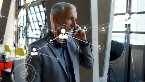 Senior Businessman Discussing Network Connections on Smartphone