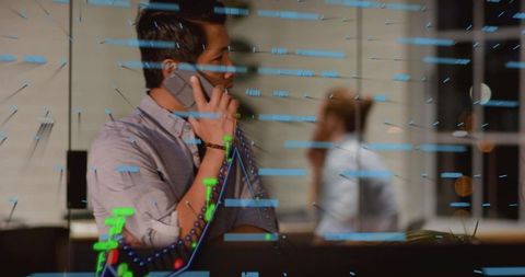 Businessman talking on phone while data visualization overlay reflecting on office glass late