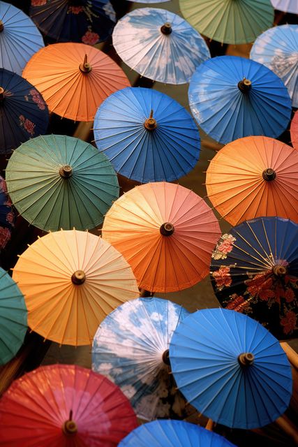 Colourful chinese umbrellas with floral patterns, created using generative ai technology - Download Free Stock Photos Pikwizard.com