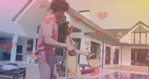 Romantic couple arriving at modern villa poolside with luggage and sun hat, summer getaway