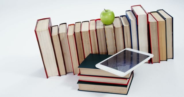 Educational Books with Apple and Digital Tablet on White Background - Download Free Stock Images Pikwizard.com