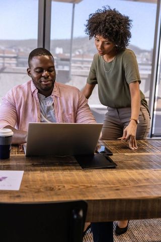 Energetic Colleagues Collaborating in Modern Office Space