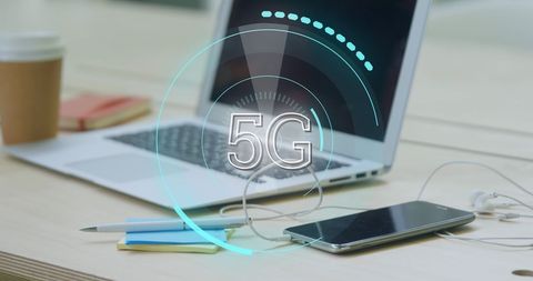 Futuristic 5G Interface on Office Workspace with Laptop and Smartphone - Download Free Stock Images Pikwizard.com