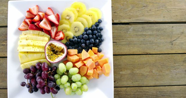 Colorful Fruit Platter with Assorted Fresh Fruits on Wooden Table - Download Free Stock Images Pikwizard.com