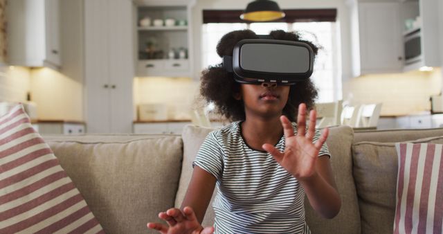 Young Girl Using Virtual Reality Headset in Living Room - Download Free Stock Images Pikwizard.com