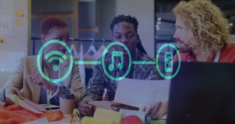 Diverse team collaborating with technology icons overlayed