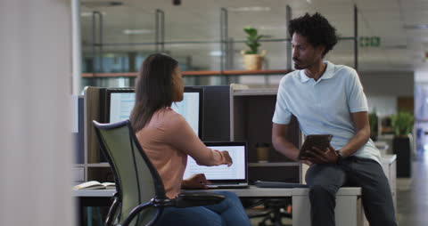 Diverse Coworkers Collaborating in Modern Office Setting