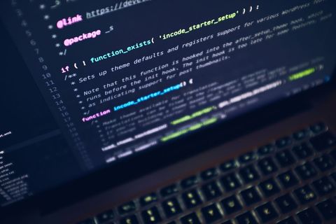 Code display on laptop screen in dark setting