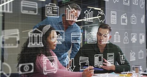 Collaborative team reviewing financial reports behind glass with digital analytics overlays