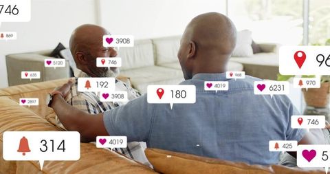 Father and son connecting on couch with social media notifications overlay for family life