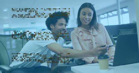 Diverse Colleagues Collaborating on Data Presentation in Modern Office