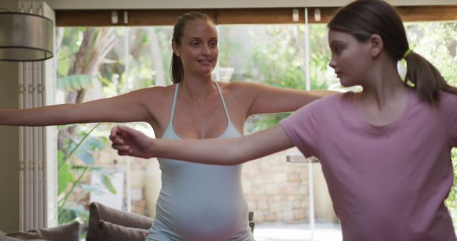 Pregnant Mother and Daughter Doing Yoga - Download Free Stock Images Pikwizard.com