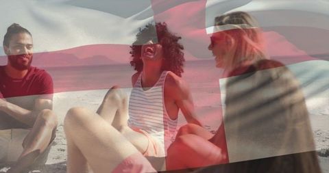Friends laughing on beach with england flag overlay, summer travel and holiday vibe